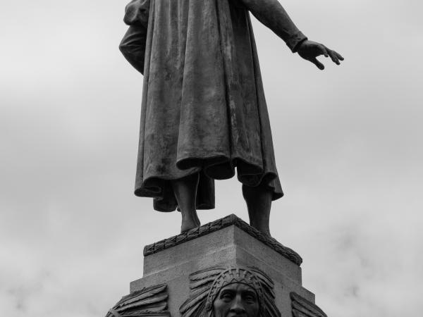 Back view of a large statue of a male figure