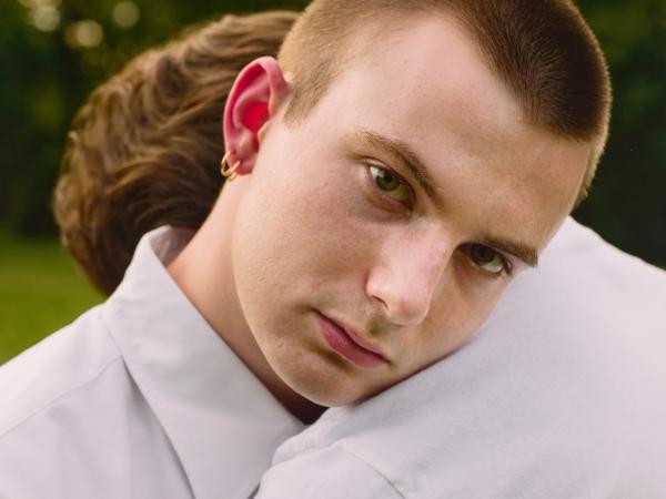 Two young men embracing