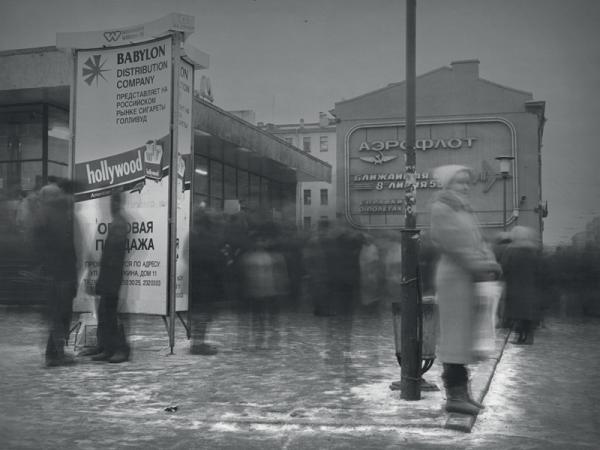 Woman standing no a street corner