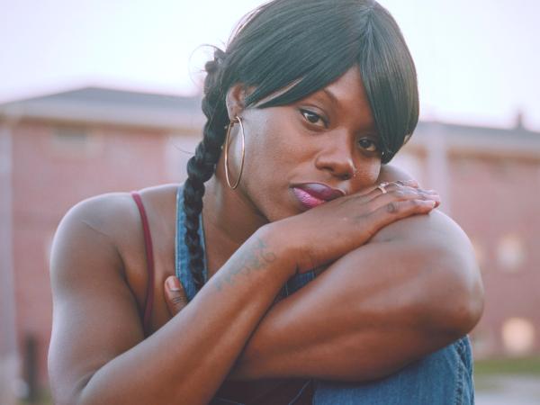 Candid portrait of an African American woman folding her arms
