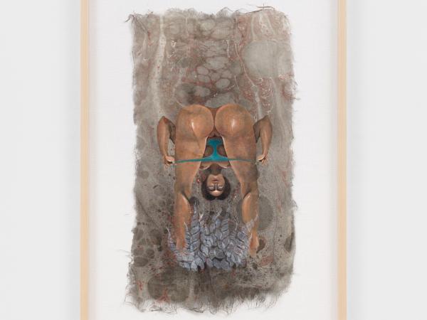 Woman from behind bent over with her head between her legs