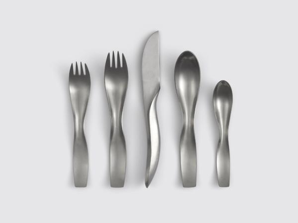 Row of five pieces of artistically designed silverware
