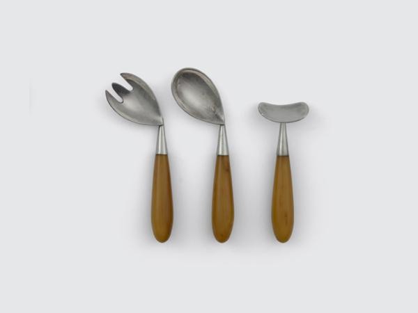 Oddly-shaped crooked silver forks with wooden handles