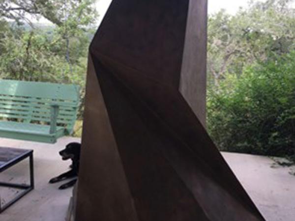 Abstract monolith-like outdoor stone sculpture