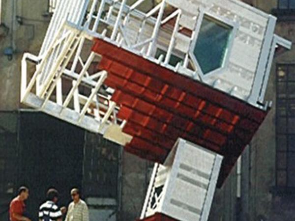 Outdoor installation of an upside down small church-like structure