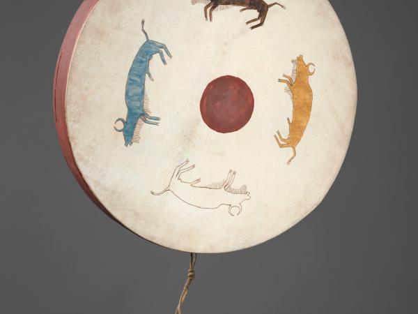 Hand drum with three animals embroidered into it, forming a circle