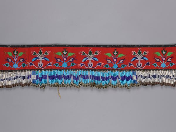 Leather strip of cloth with dangling beads adorned on the bottom