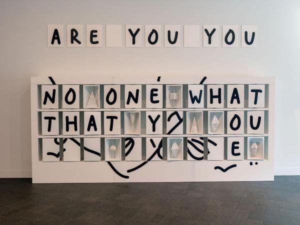 Text installation that reads "Are you you"