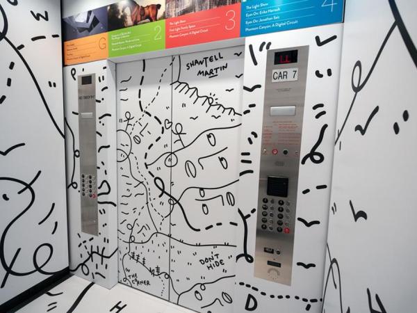 Installation view of a room covered in Shantell Martin words and lines