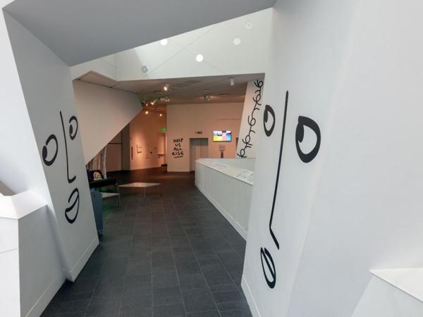 Hallway of the museum with Shantell's art on opposing sides