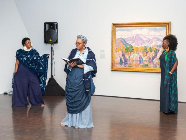 women doing spoken word performance in art gallery at Untitled Final Friday
