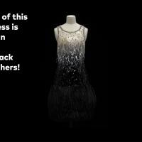 The bottom of this dazzling dress is covered in an unexpected material: black ostrich feathers.