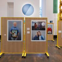Easel displaying photographs of grandparents with their grandchildren
