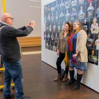 Two women posing for a photo taken by another visitor