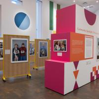 Angled view of easels displaying photographs inside the exhibition