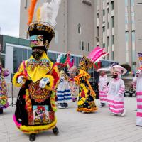 Group of performers dressed in colorful traditional clothing