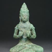 Seated bronze religious figure
