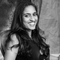 Black and white photo of Chitra Ganesh, a dark-haired woman in her 30s
