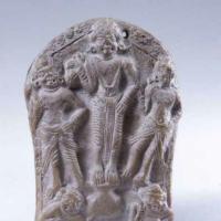 Plaque of three Indian figures etched into stone