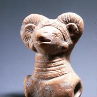 Cart toy in the shape of a ram with horns
