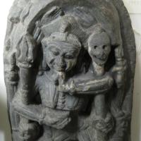 Stone rounded carving of Indian royal figures