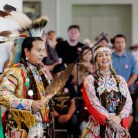A man and woman performing at Powwow