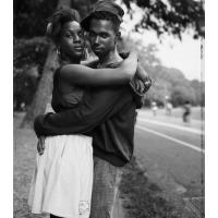 A young black couple embracing