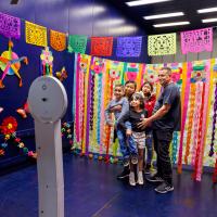 Family of visitors posing for a group photo at Dia Del Nino in 2024