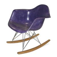 Purple rocker chair made out of fiberglass and wood
