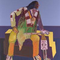 Side profile of a Native American man sitting and leaning forward on a bench