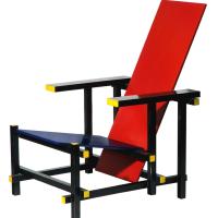 Low wooden chair with a red back and black base