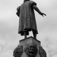 Back view of a large statue of a male figure
