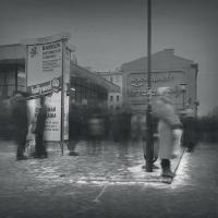 Woman standing no a street corner