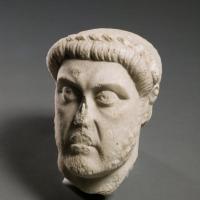 a white ceramic bust of a man's head