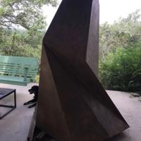 Abstract monolith-like outdoor stone sculpture
