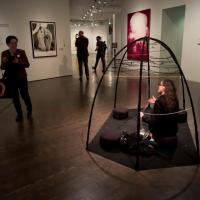 Viviane Le Courtois sitting in the Global Thinking Pod, inviting a passerby to join her in conversation