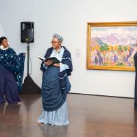 women doing spoken word performance in art gallery at Untitled Final Friday