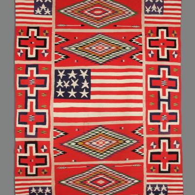 Blanket/Rug with bright red, white, and blue patterns in various shapes