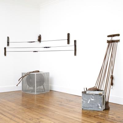 Mixed media installation against white wall backdrop