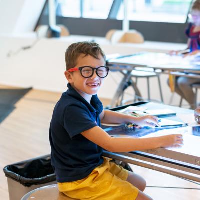 Young boy smiling at the camera