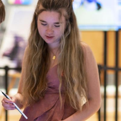 Teen girl holding a pencil