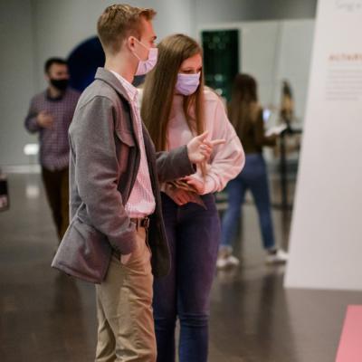 Young adults discussing an artwork