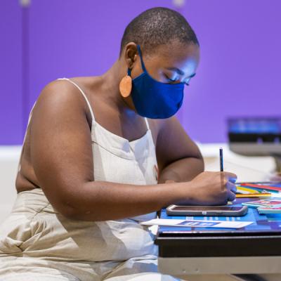 Young African American teen creating art