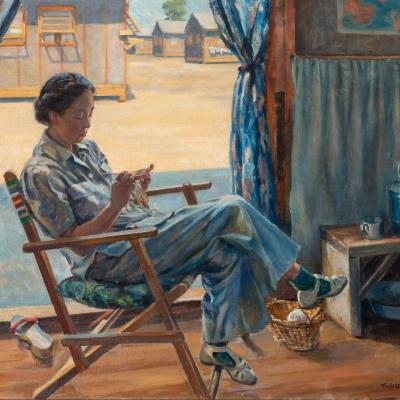 Japanese woman sitting and knitting in a rocking chair