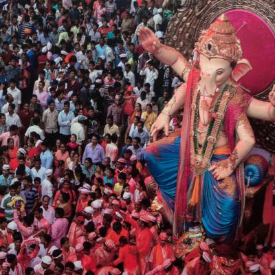 photo of a crowd and a giant Ganesha statue at Ganesha Chaturthi Festival in Mumbai