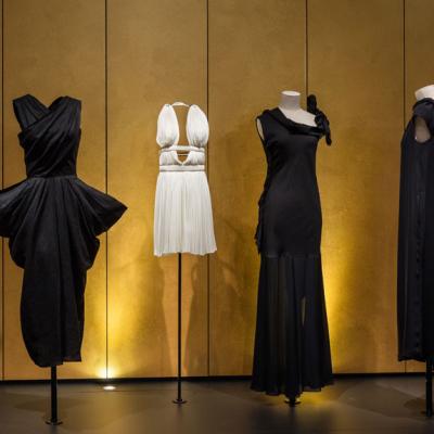 4 dresses on invisible dress forms in Shock Wave