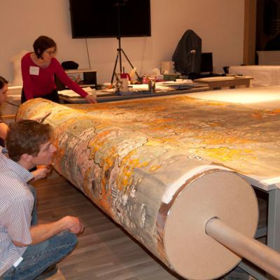 staff rolling map onto sono tube