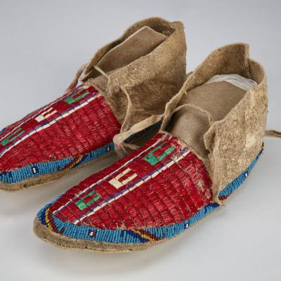 Moccasin made using porcupine quills from an unknown maker in the Crow Tribe