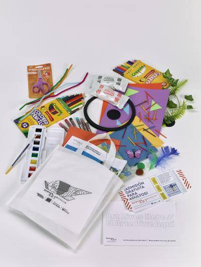 Creativity Kits made by the Denver Art Museum which includes crayons, paints, colored pencils, scissors, construction paper, and other crafting supplies