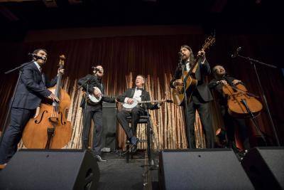 Governor John Hickenlooper joining in the performance fun at a Collectors' Choice event.